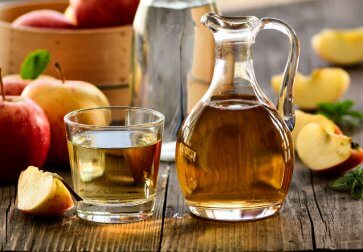 A jug of vinegar which will be used to make natural remedies to combat head lice