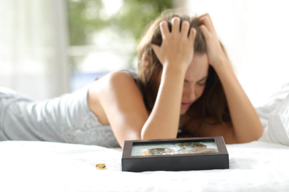Upset woman after her partner cheats on her.