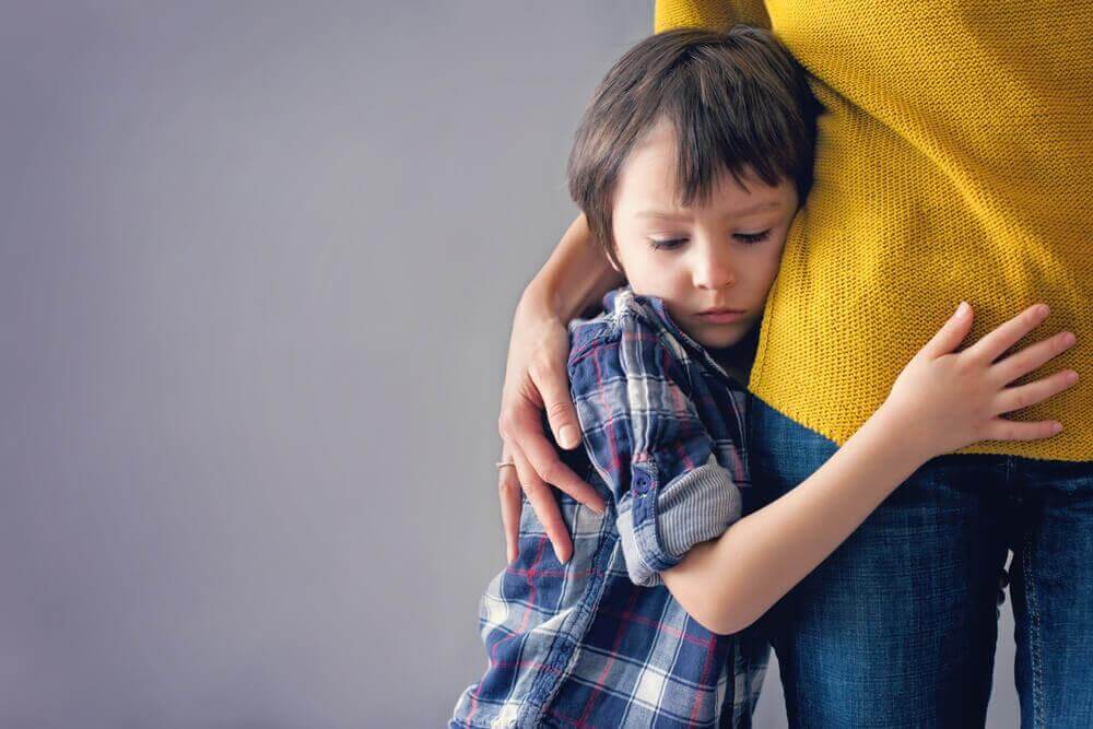child hugging his mother