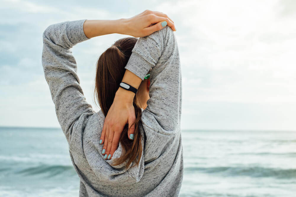 Shoulder stretch by the sea.