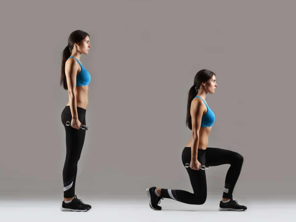 Woman doing lunges with weights