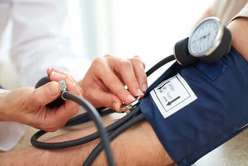 A doctor checking a patient's blood pressure.
