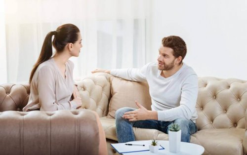 Couple arguing on sofas