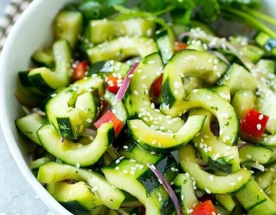 A photo of a cucumber and tomato salad.
