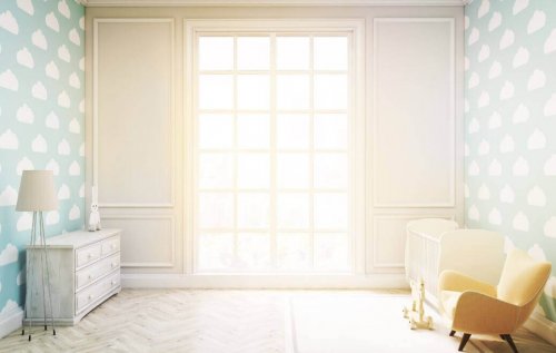 An empty space in front of a window which is one way to make your living room look bigger