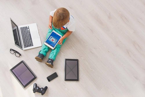 A child playing with electronic devices. alternatives to punishment