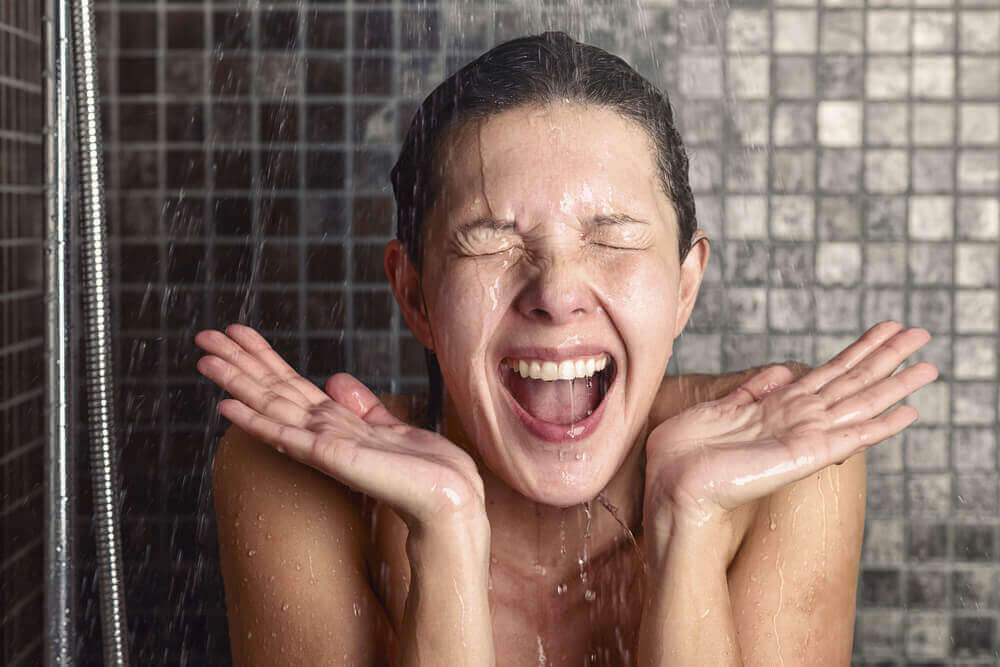 A woman enjoying a shower.