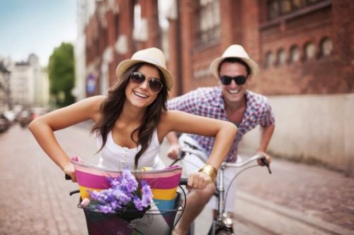 A couple biking together.