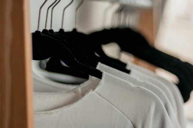 Some clothes hung in the closet.