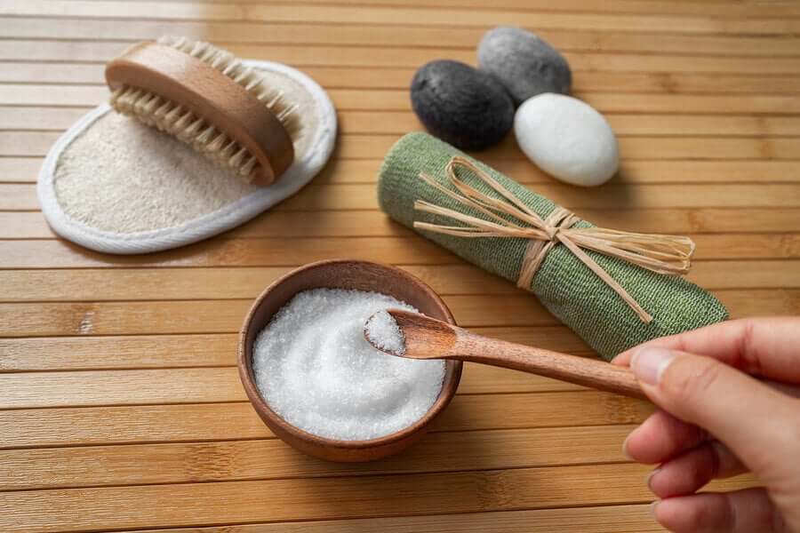 A person preparing an epsom salt treatment.