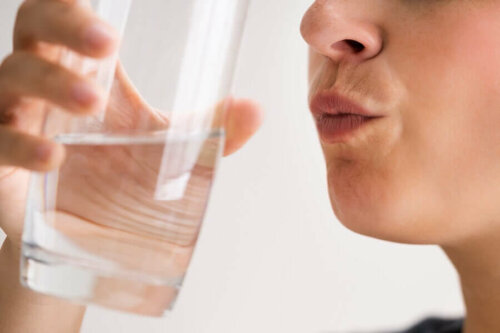 A woman rinsing her mouth.