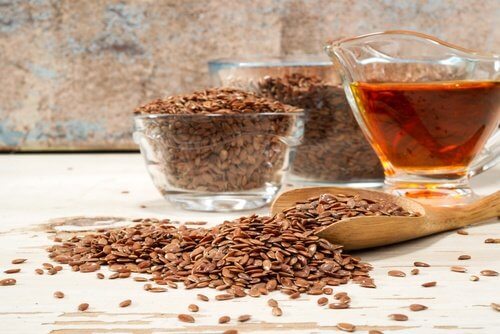 The medicinal flaxseed drink is next to bowls of flaxseed.
