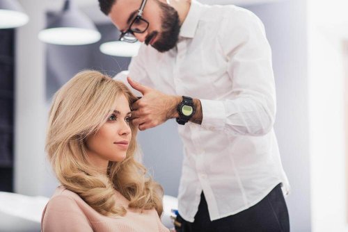 A woman getting her hair cut.