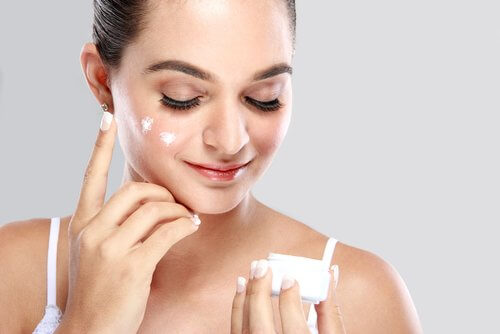 Rejuvenating aloe vera cream on a woman's face