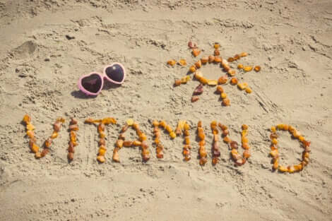 Vitamin D written in the sand.