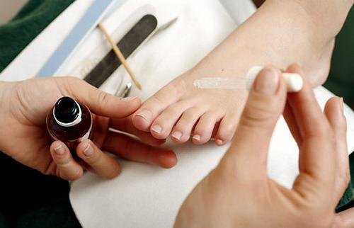 A woman getting a pedicure.