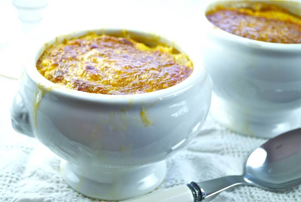 A delicious bowl of cream of garlic soup ready to be eaten.