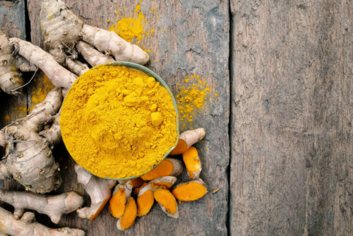 Some turmeric on a wooden table.