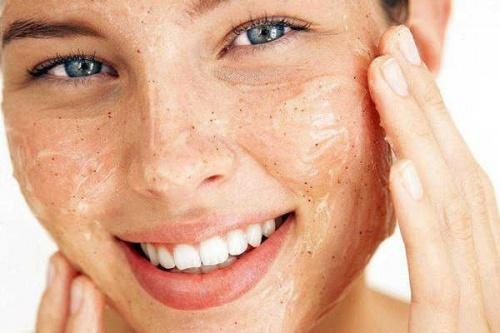 A woman exfoliating for clean and smooth skin.