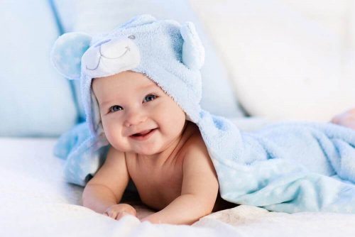 A baby laying on their stomach.