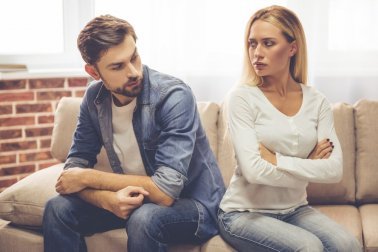 Angry couple looking at each other.