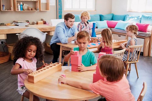 Children playing in a classroom.