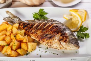 Delicious Baked Sea Bass with Potatoes and Onion