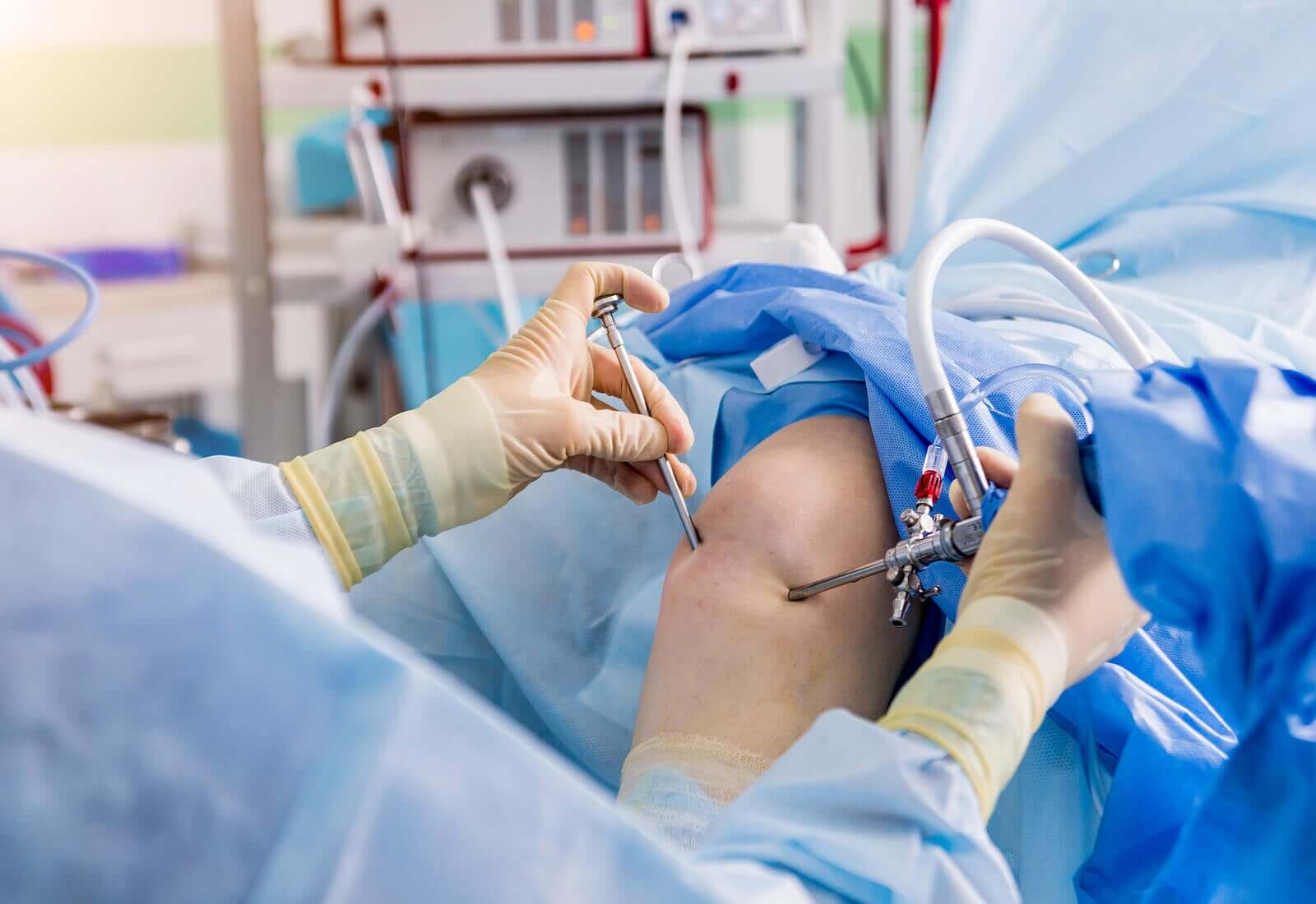 A doctor performing a meniscus operation.