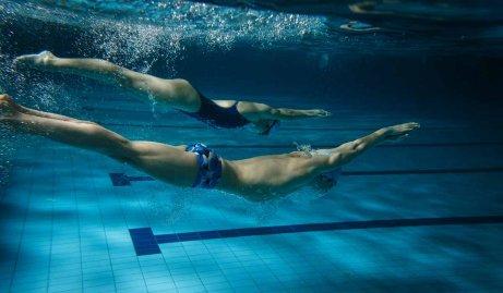 People in a swimming class.