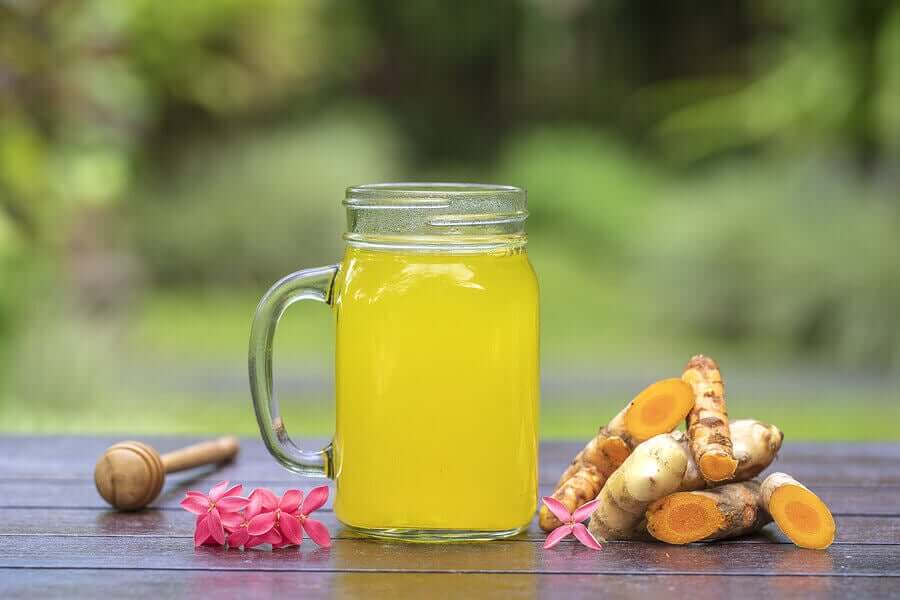 A glass of turmeric drink.