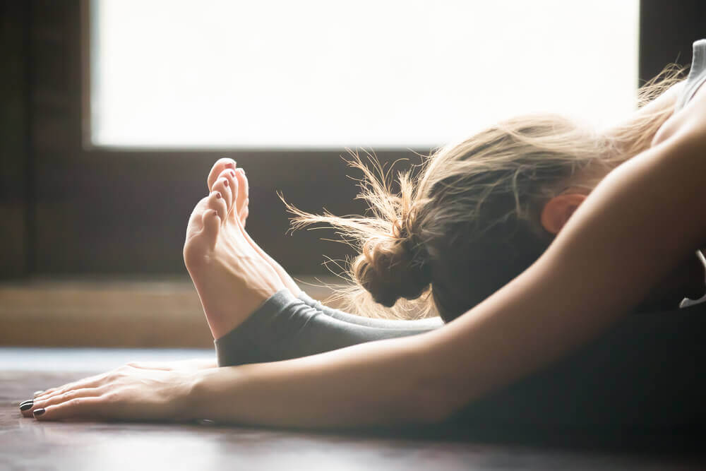 A woman doing a yoga stretch.