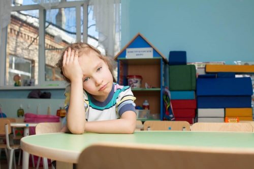 A girl looking upset, perhaps she's overloaded with activities and has no time to play.