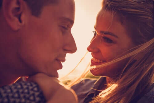 A happy couple looking into each other's eyes.