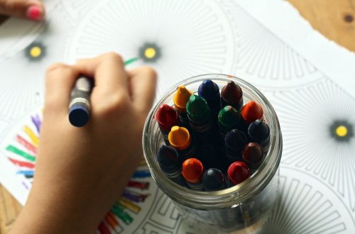 A tiny hand drawing with crayons.