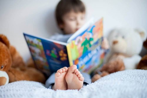 Boy in bed reading