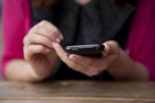 Cell phone in the hand of a woman