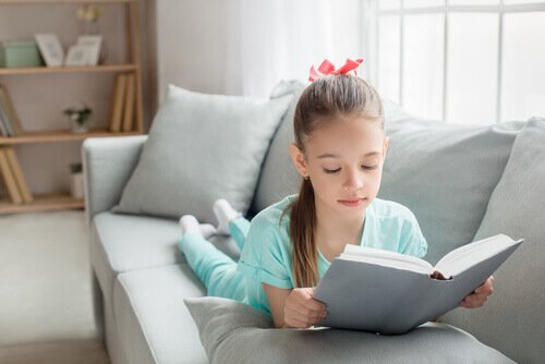 Girl reading on couch