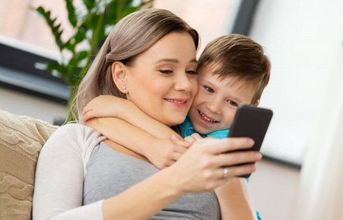 Mom and son using smartphones