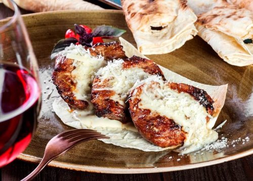 Three parmesan veal steaks.