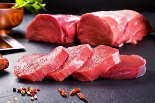 A display of raw veal and steaks.