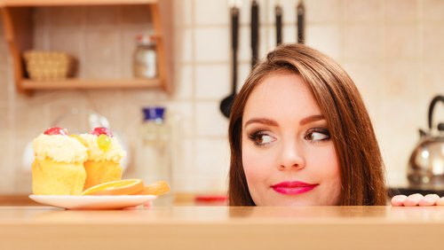 Woman looking at a cake