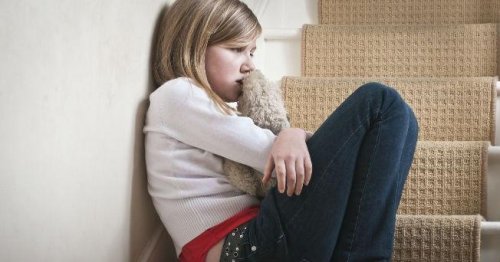An abused child crying.