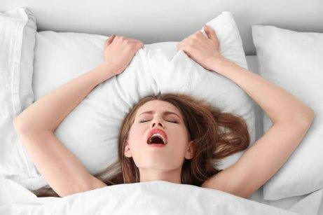 A woman having an orgasm.