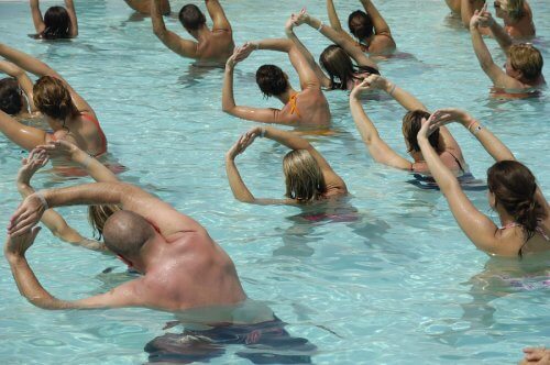 A group of people exercising in a pool.