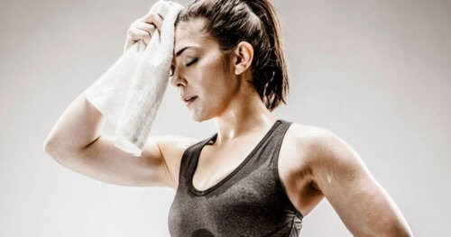 A overheated woman sweating excessively.
