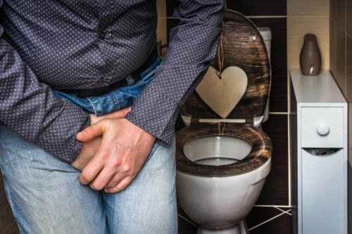 A man near a toilet.