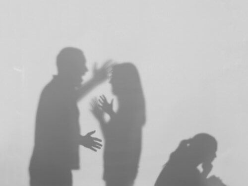 A couple arguing in front of their child.