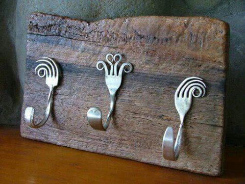 A coat rack made with forks.