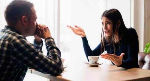 A seemingly upset woman talking to a man.