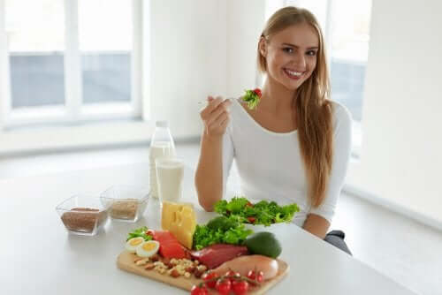 A woman eating a salad.